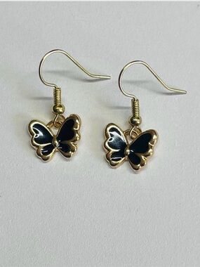 Gold Butterfly Drop Earrings with Black Enamel Accents